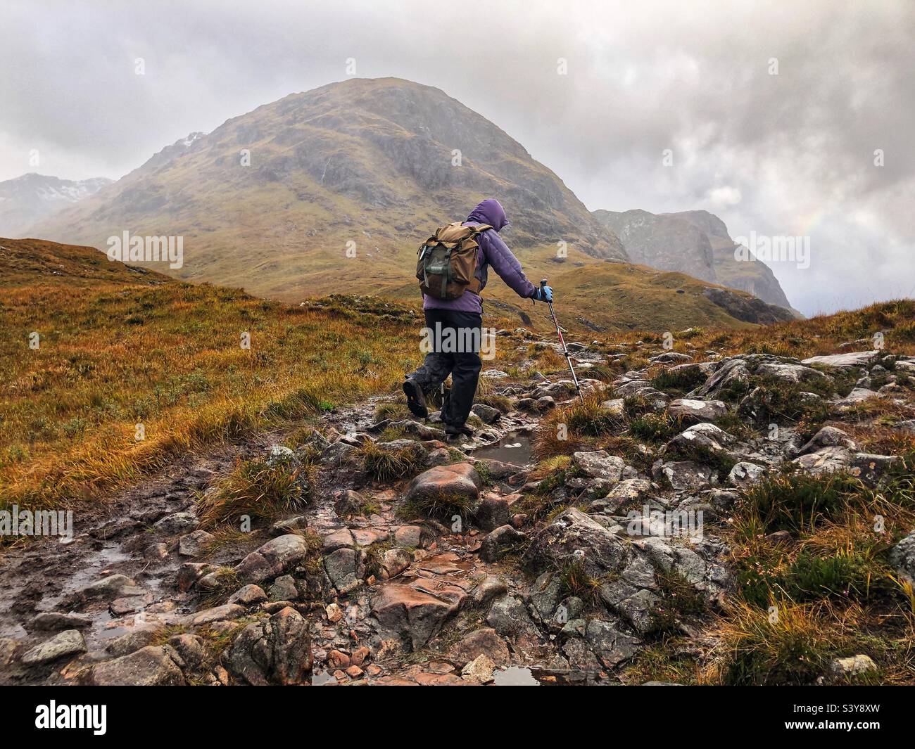 Female Walker on the path and slopes of Munro Buachaille Etive Beag, Glencoe, Scotland - Smartphone Captured Stock Image
