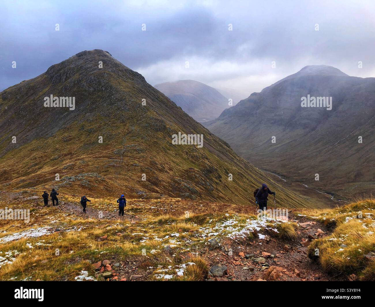 Walkers on the path and slopes of Munro Buachaille Etive Beag, Glencoe, Scotland - Smartphone Captured Stock Image