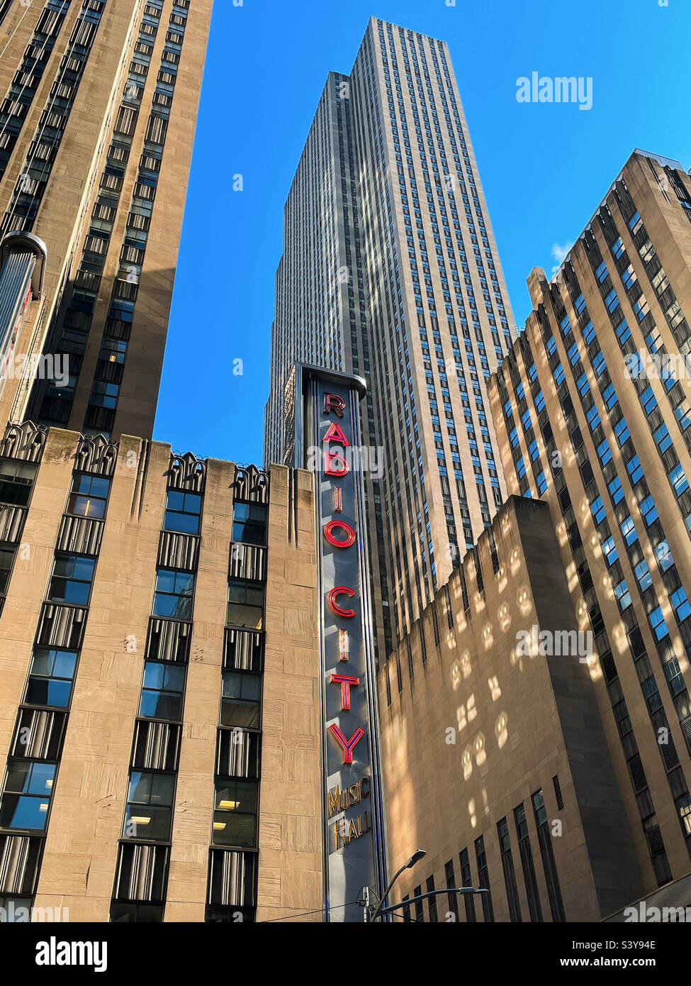 Radio city music Hall is located on 6th Avenue at Rockefeller Center,, 2022, New York City, USA - Smartphone Captured Stock Image