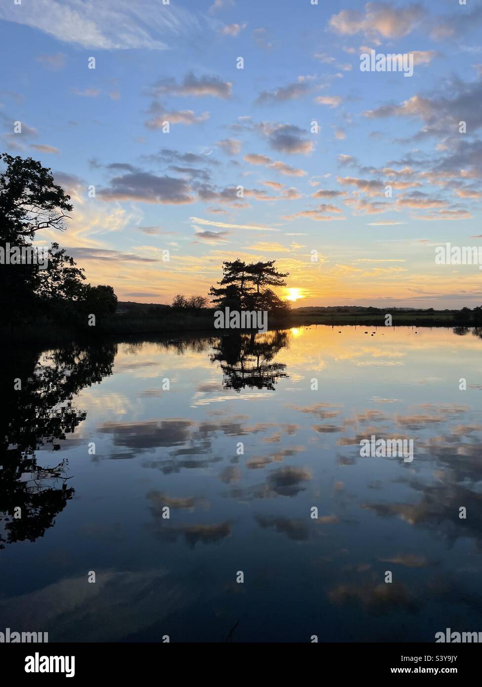 Autumn sunset reflection. - Smartphone Captured Stock Image