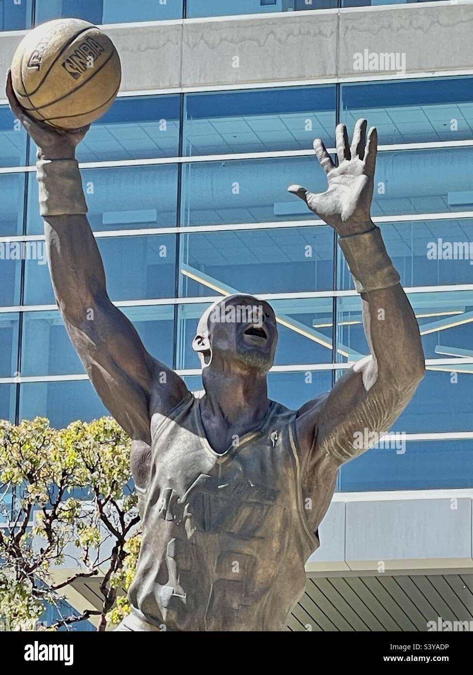 In front of the Vivint Arena, the home of the NBA team, The Utah Jazz, in downtown Salt Lake City, Utah, USA. This shows a larger than life bronze statue of one of the teams greats, Karl Malone. Stock Photo
