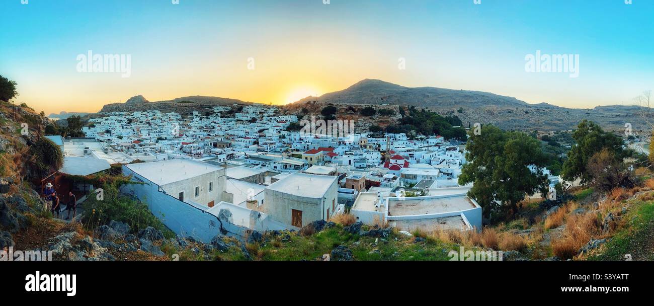 Town of Lindos on island of Rhodes at sunset Stock Photo