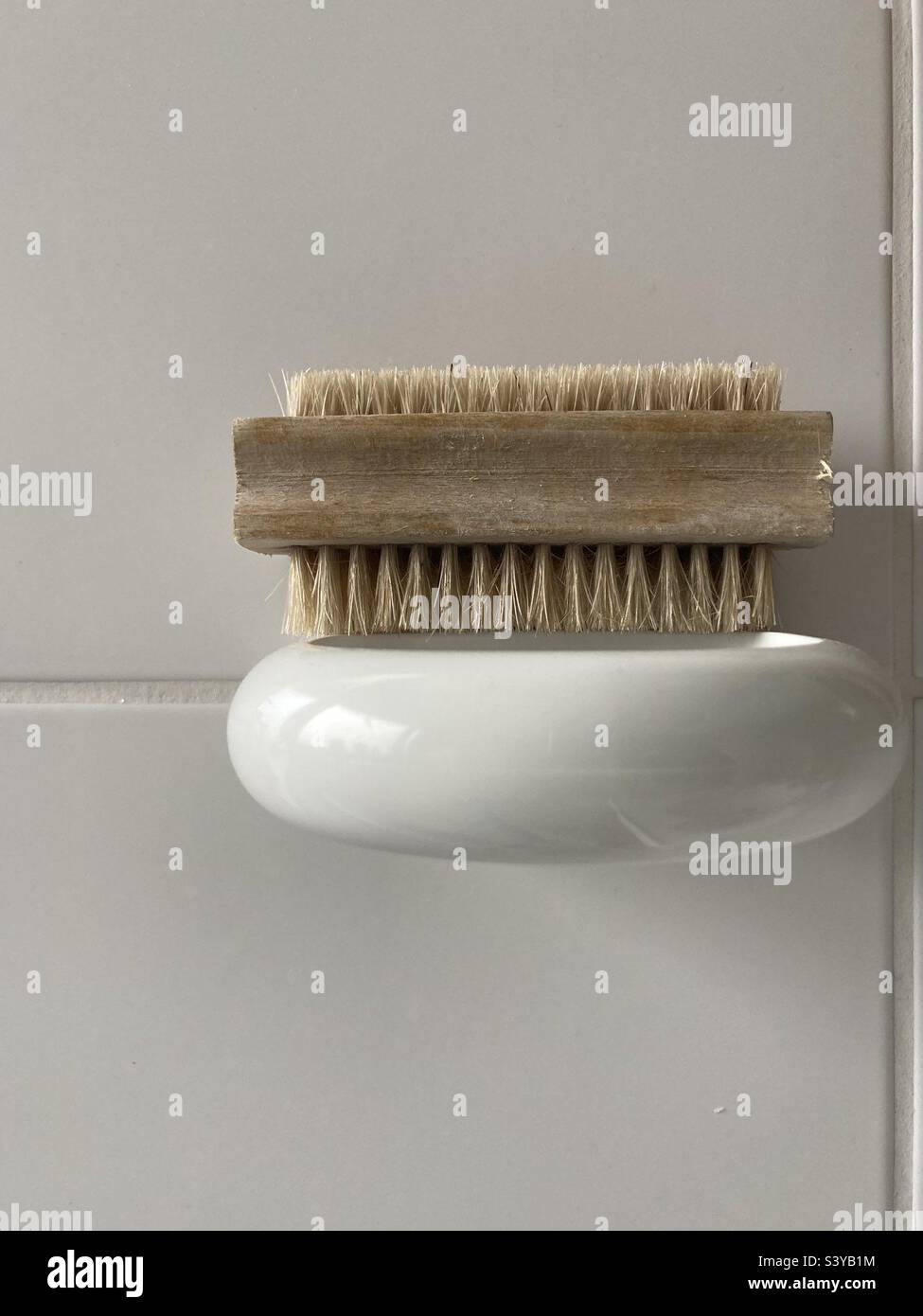 Brush on a shelf in front of white background - Smartphone Captured Stock Image