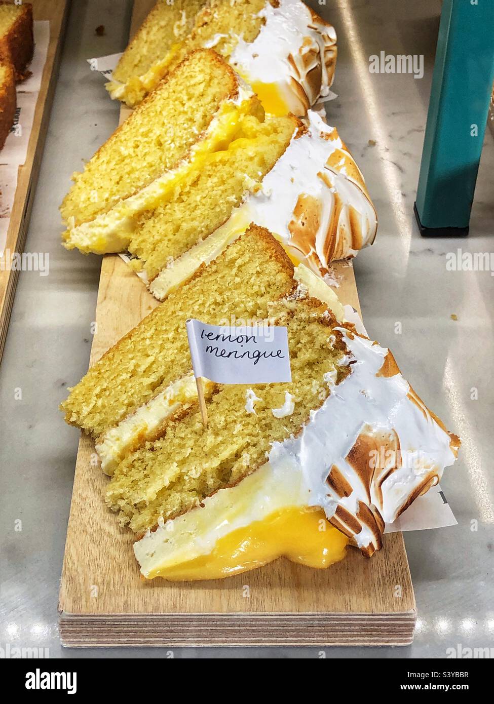 Lemon Meringue pie cake in bakery window - Smartphone Captured Stock Image