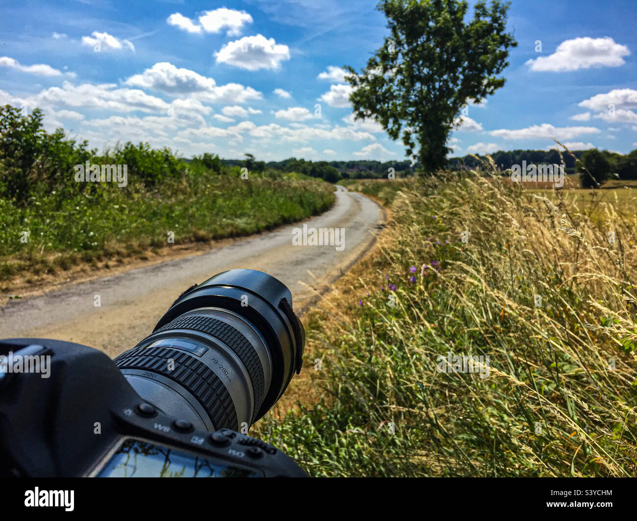 A photographers view of the open road waiting for a cycle event to pass - Smartphone Captured Stock Image A photographers view of the open road waiting for a cycle event to pass - Smartphone Captured Stock Image