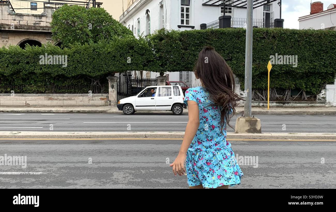 girl crossing the street. child safety Stock Photo