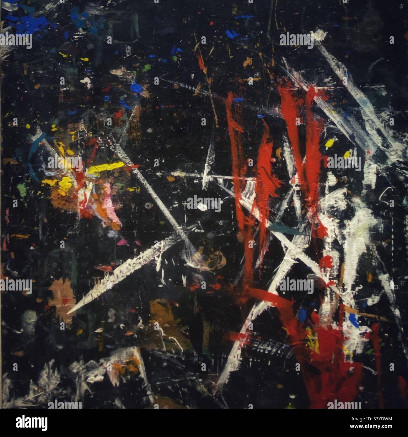 A photograph of a messy art board with masking tape paint marks. Abstract remnants of an artist’s process - Smartphone Captured Stock Image