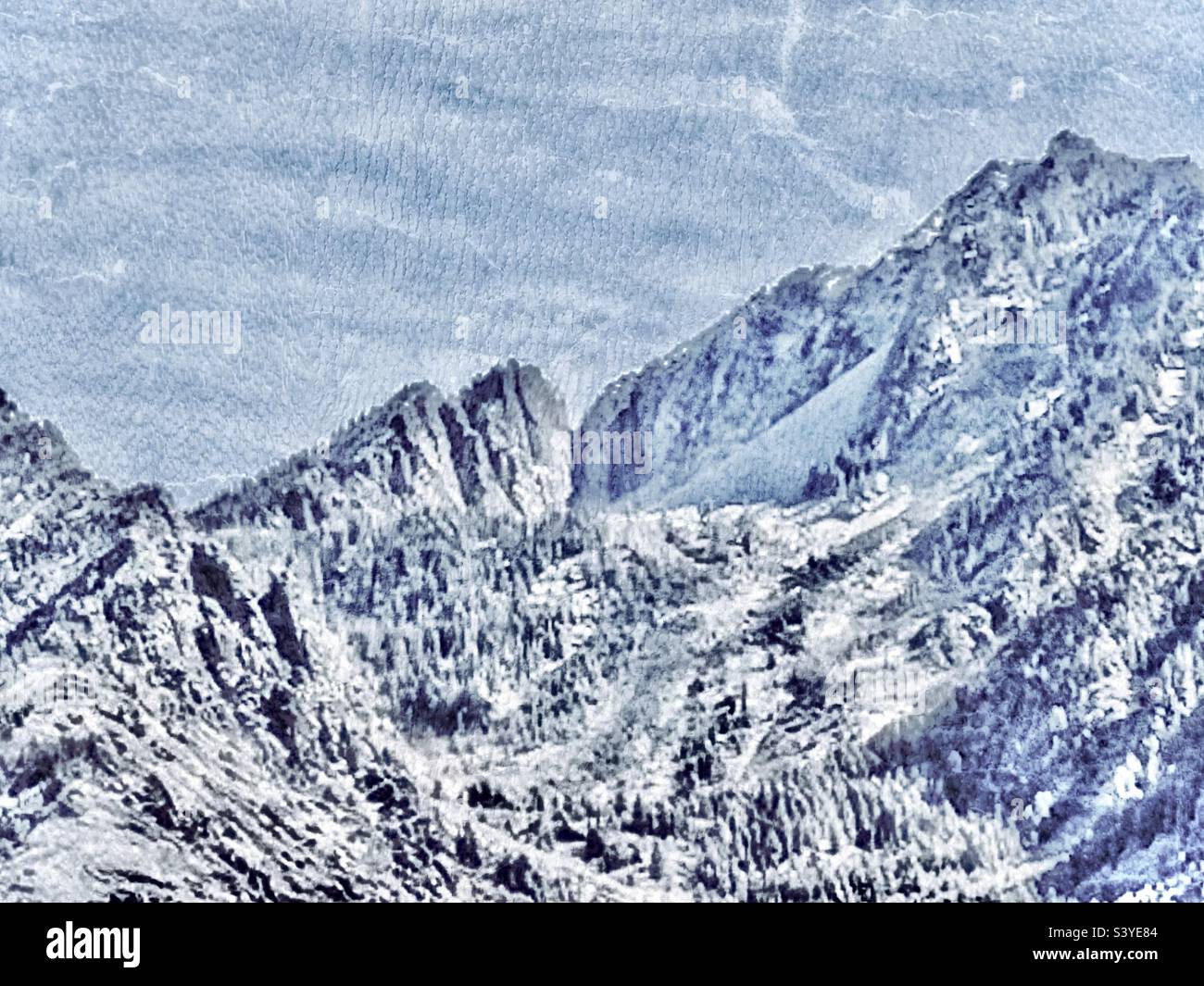 A grungy, textured rendering of a photo of the snow covered Wasatch Mountains lying east of the Salt Lake valley of Utah, USA. These are further south of the SLC metro area. White, rugged beauty. Stock Photo