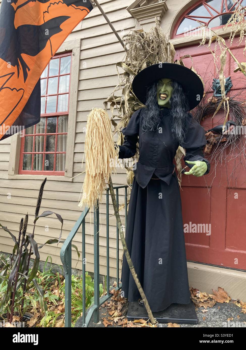 Witch on the doorstep of an old home in Clinton, Connecticut - Smartphone Captured Stock Image
