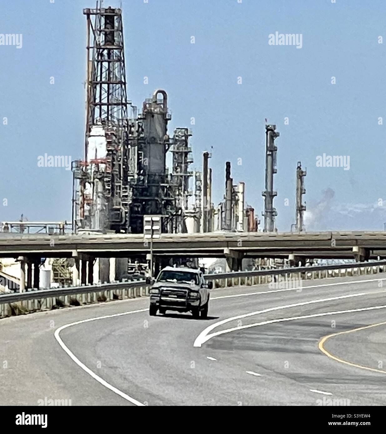 Traffic along the I-15 interstate freeway, passing near the industrial area between Bountiful and Salt Lake City, Utah, USA. This area has many working gas and oil refineries. - Smartphone Captured Stock Image