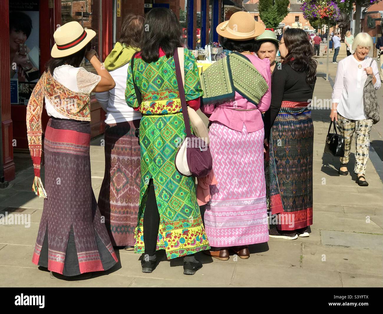 Group of Thailand woman tourists in traditional dress visiting Stratford upon Avon Warwickshire England UK - Smartphone Captured Stock Image