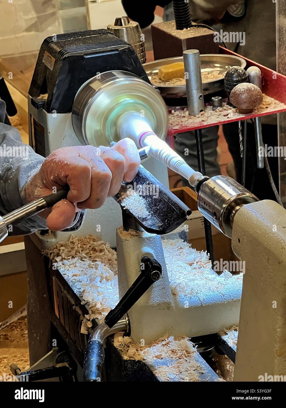 Creating a masterpiece with wood on the lathe stock photo alamy