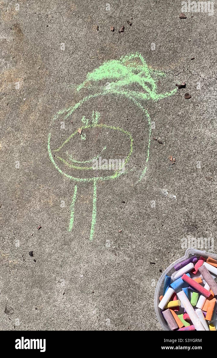 Chalk drawing of stick figure on sidewalk with bucket of multicolored