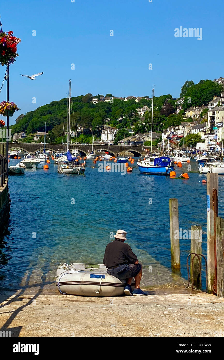 Crowded moorings on the River Looe in summer sunshine, Cornwall, UK - Smartphone Captured Stock Image