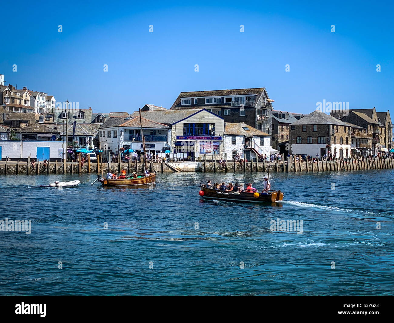 Boating passenger ferry activity on the River Looe in summer sunshine, Cornwall, UK - Smartphone Captured Stock Image