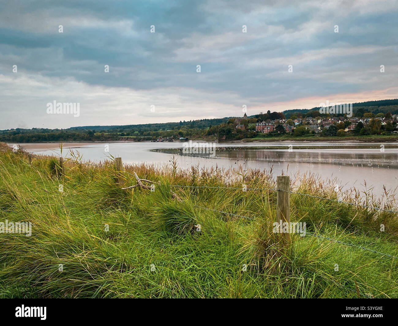 An atmospheric autumn view of the river Severn at low tide at Arlingham, Gloucestershire, UK. A mobile phone photo with some phone or tablet post processing. - Smartphone Captured Stock Image