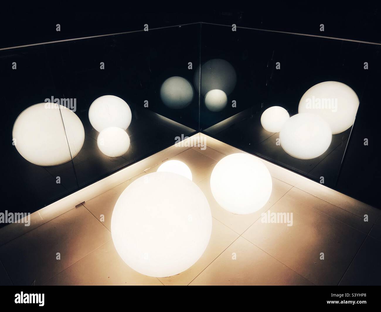 Light globes reflected in glass - Smartphone Captured Stock Image