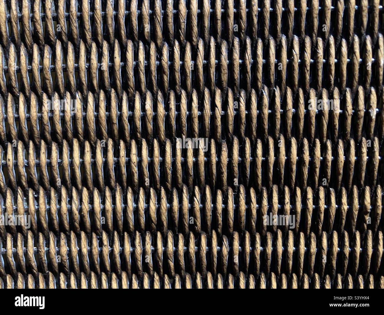 a brown braided rattan pattern - Smartphone Captured Stock Image