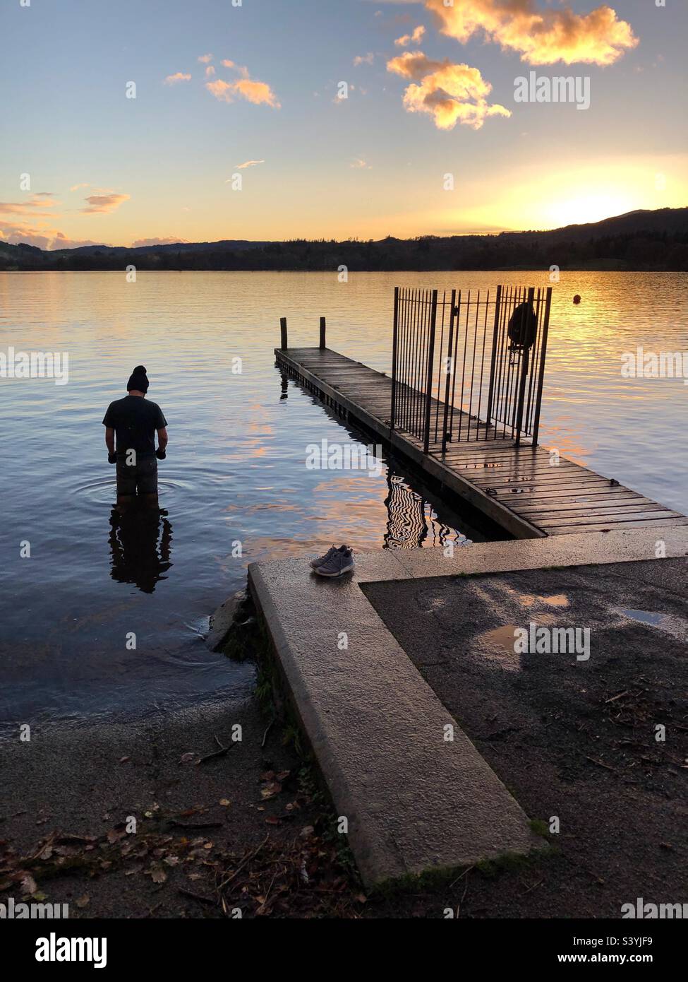 Wild swimming in Lake Windermere at dusk, Cumbria Lake District - Smartphone Captured Stock Image