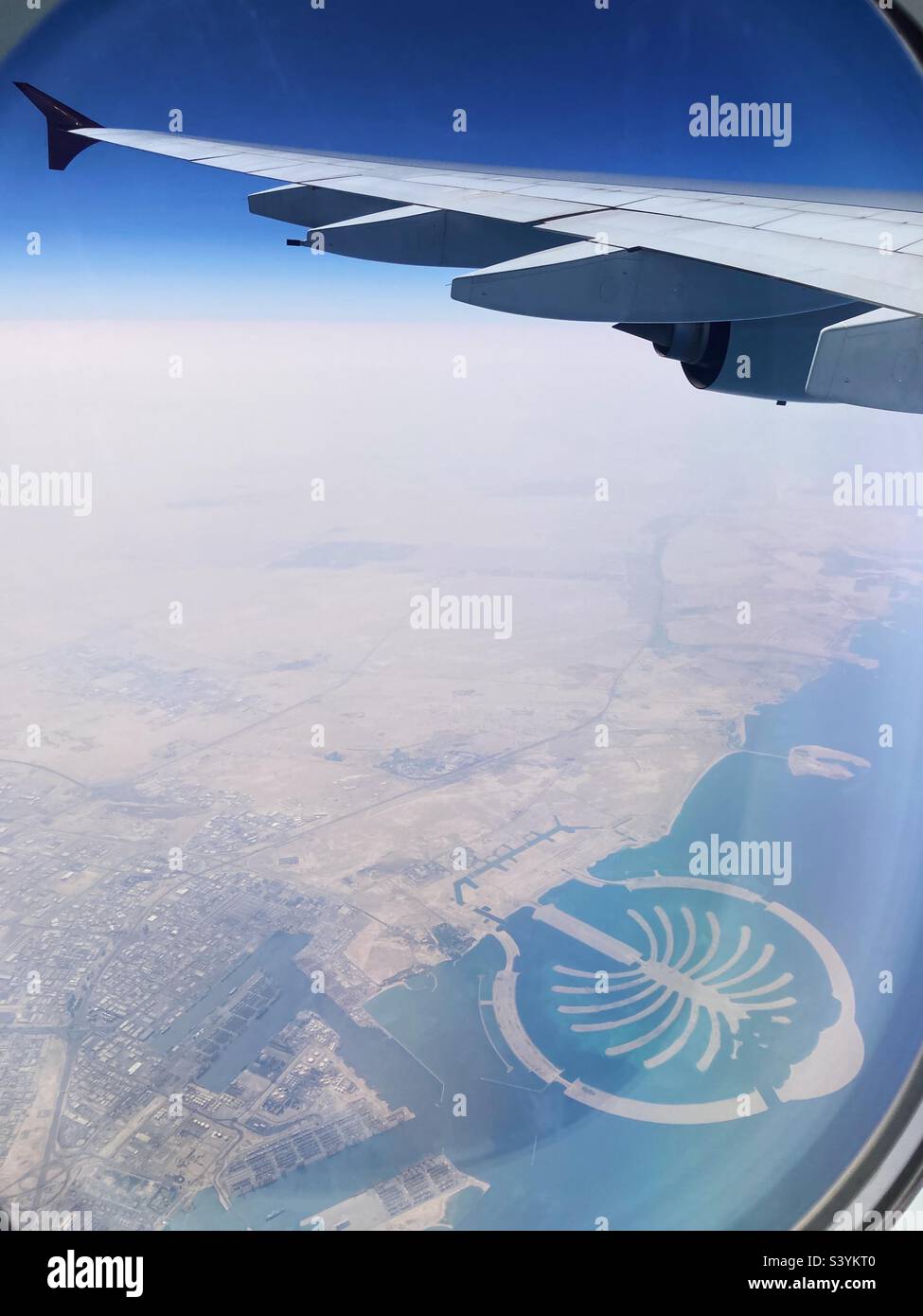 View through an airplane window of Palm Jumeirah, treeshaped