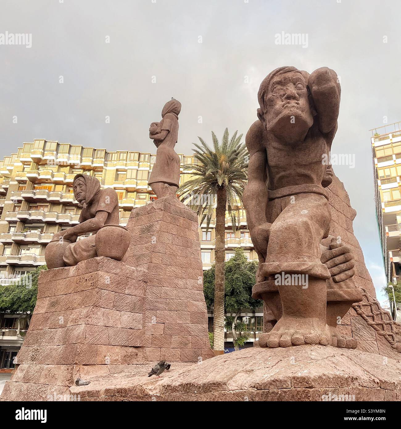 Monument to the Activities of the Primitive Canarians or Monumento Actividades Primitivas Canarias is by Luis Alemán Montull and in the Plaza Espãna, Las Palmas celebrates 500 years of the city - Smartphone Captured Stock Image