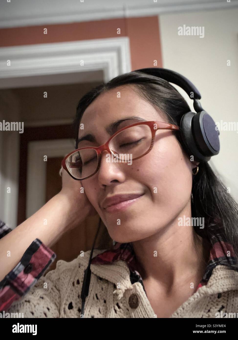 A woman listening to music - Smartphone Captured Stock Image