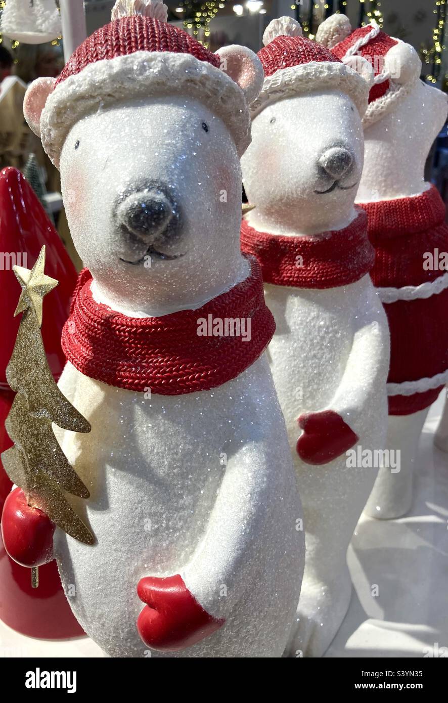 Polar bear ornaments wearing hats and scarves for Christmas Stock Photo