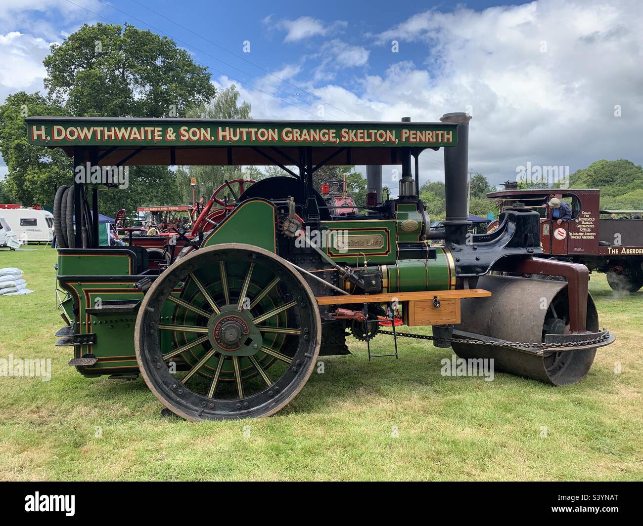 Old fashioned vintage steamroller on display in a countryside field at the royal Bath and West show in summer, England Stock Photo