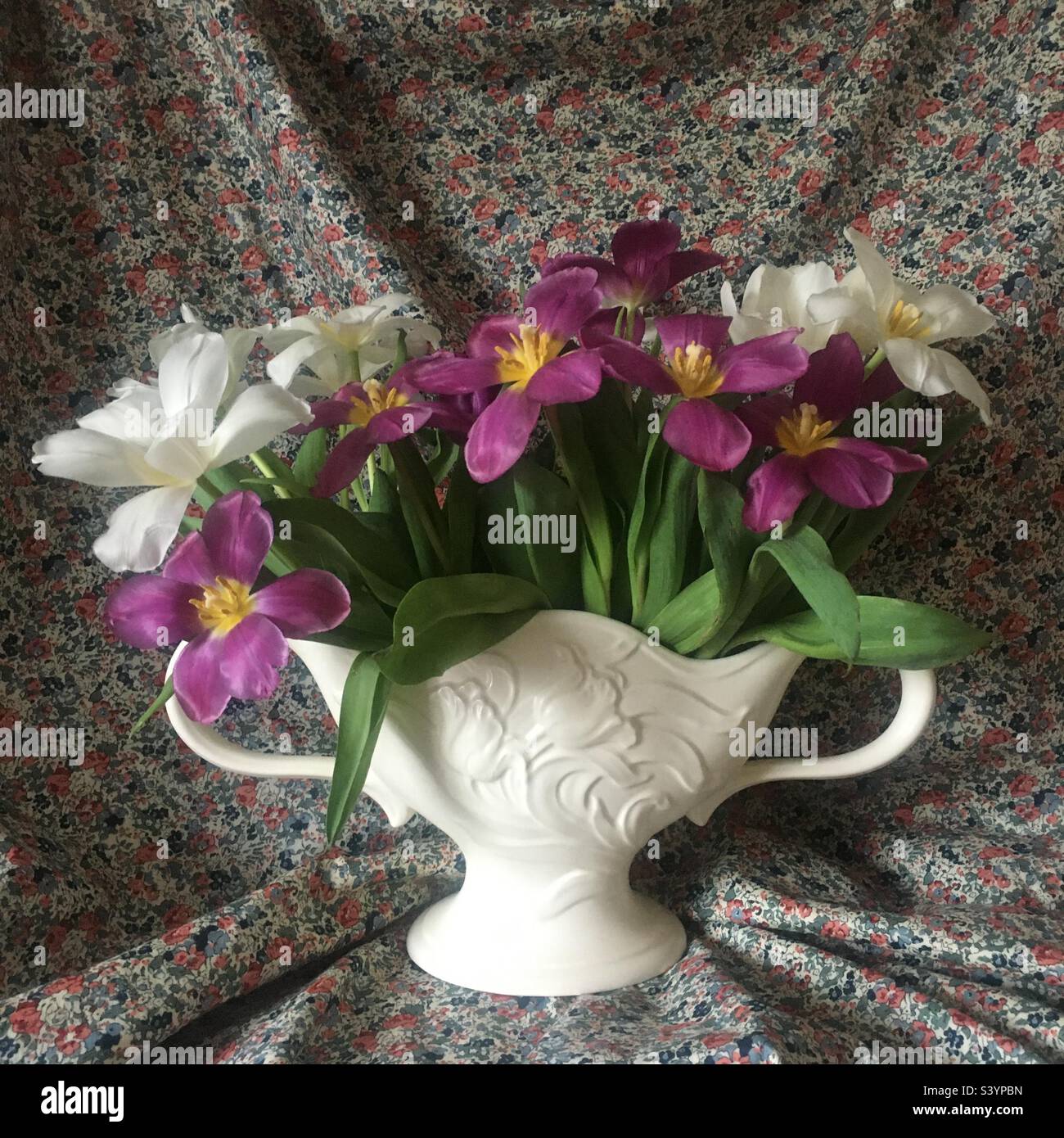 Open tulips in mantle vase Stock Photo Alamy