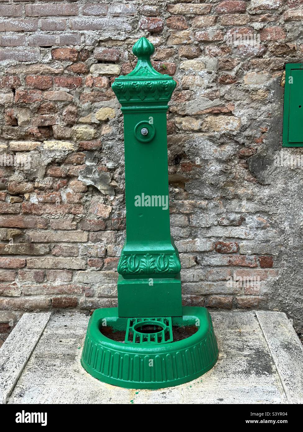 Green colored cast iron fountain in Italy - Smartphone Captured Stock Image