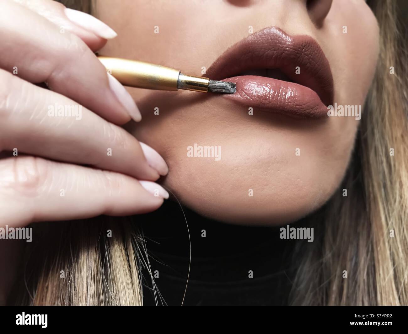 Applying liquid lipstick - Smartphone Captured Stock Image