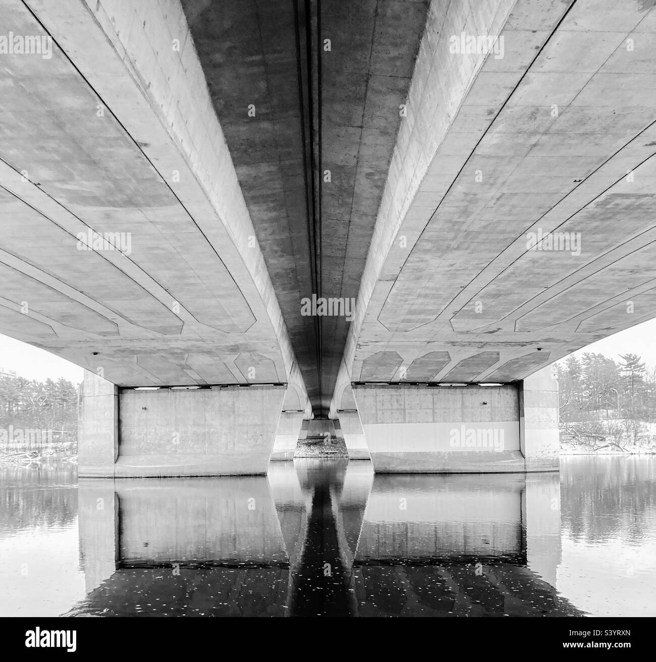 Reflections under a bridge downtown in black and white. - Smartphone Captured Stock Image