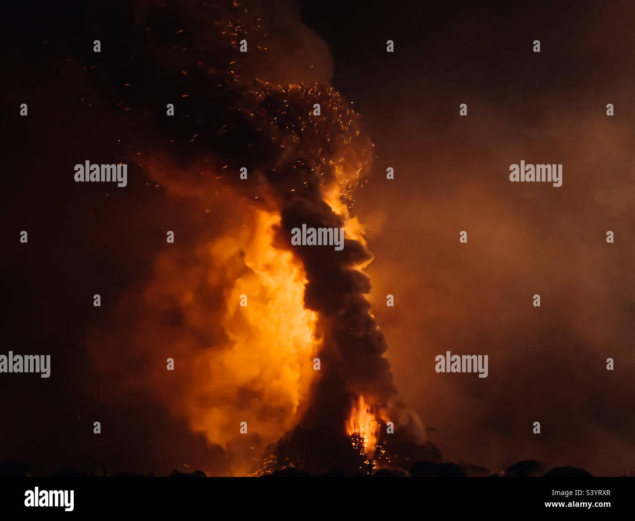 Smoke and flames of Lewes Bonfire celebration, November 2022 - Smartphone Captured Stock Image