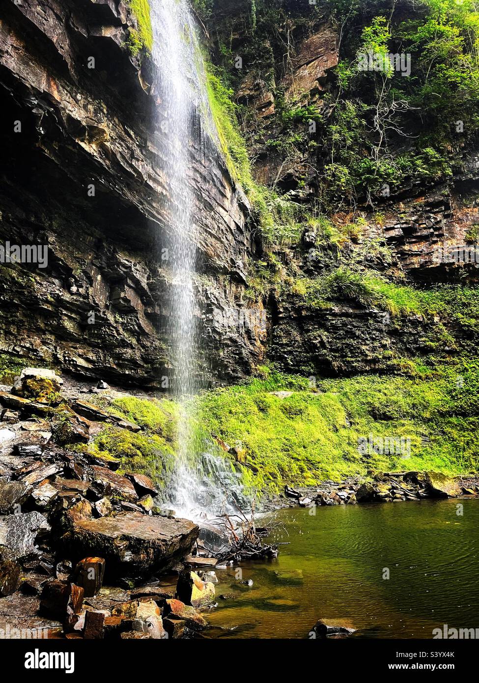 Henrhyd waterfall, Nant Llech stream plunges 27m into the valley. Brecon Beacons during a dry spell. - Smartphone Captured Stock Image