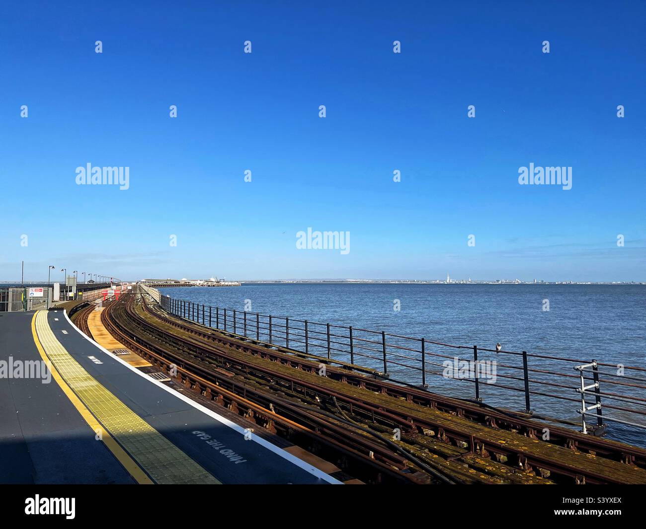 Platform at the end of the pier at Ryde Isle of Wight with Portsmouth on the horizon across the Solent - Smartphone Captured Stock Image