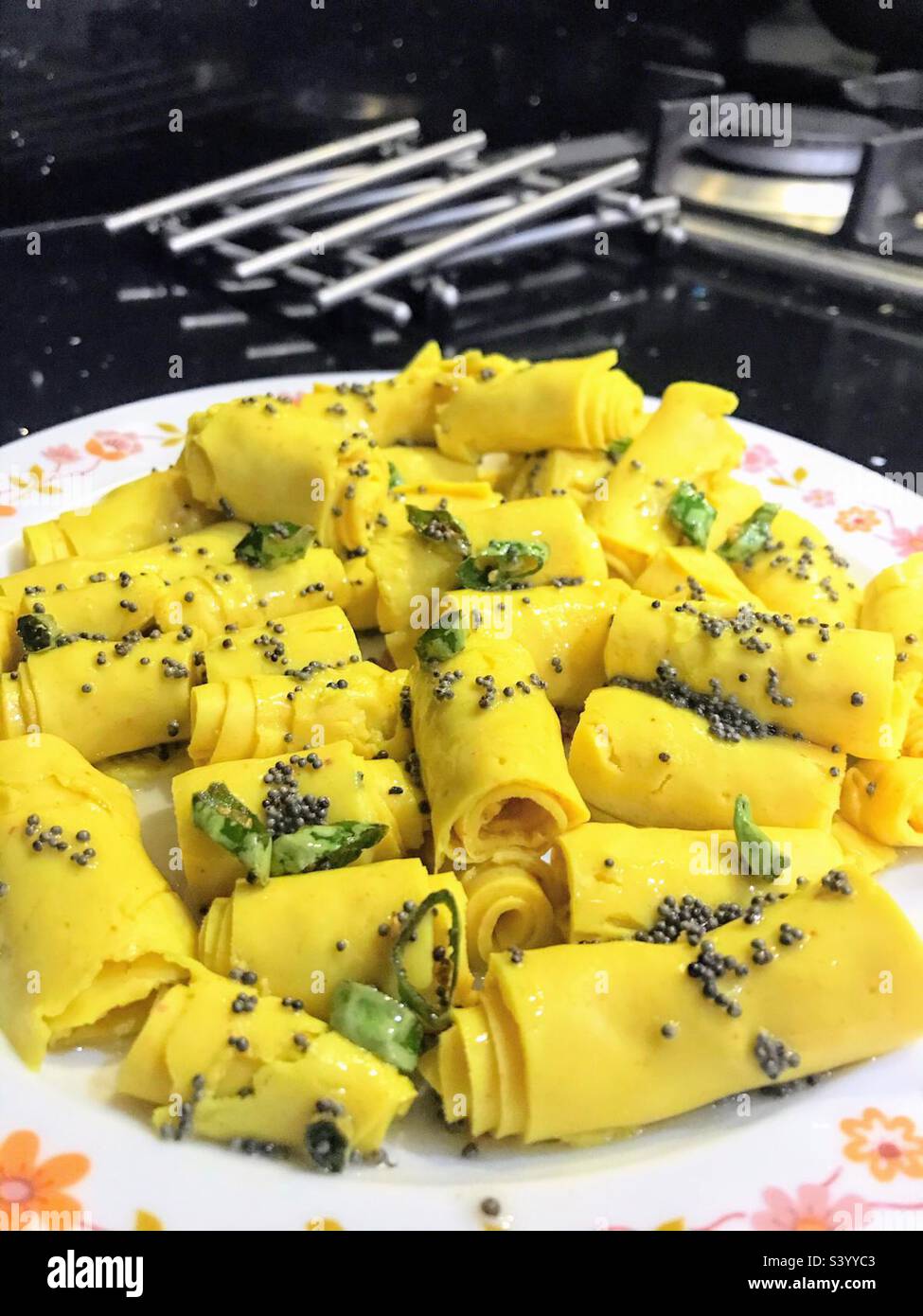 Gujarati snack food, Khandvi, is made of chickpea flour Stock Photo Alamy