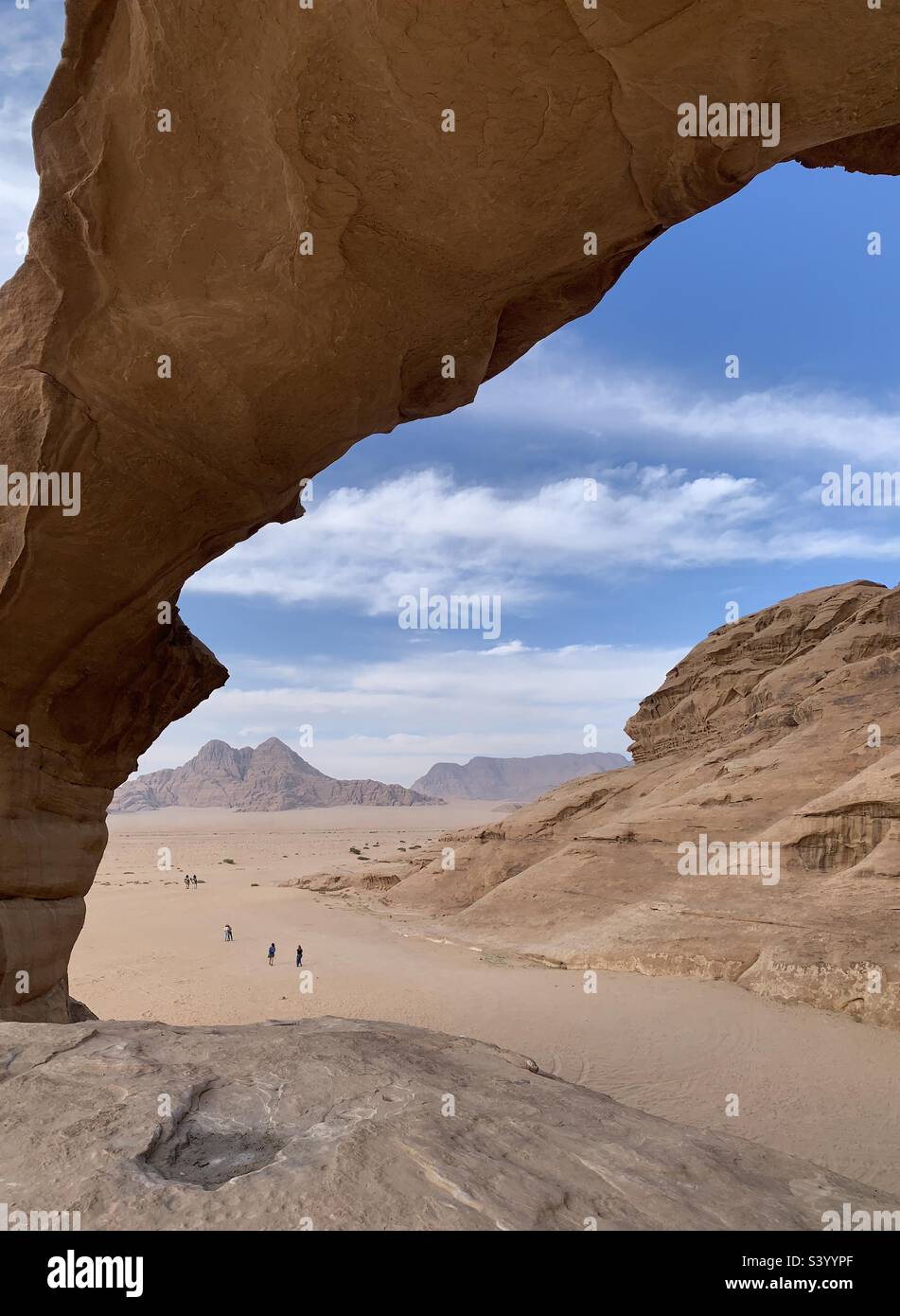 Rock arch in north desert wadi rum Jordan Stock Photo