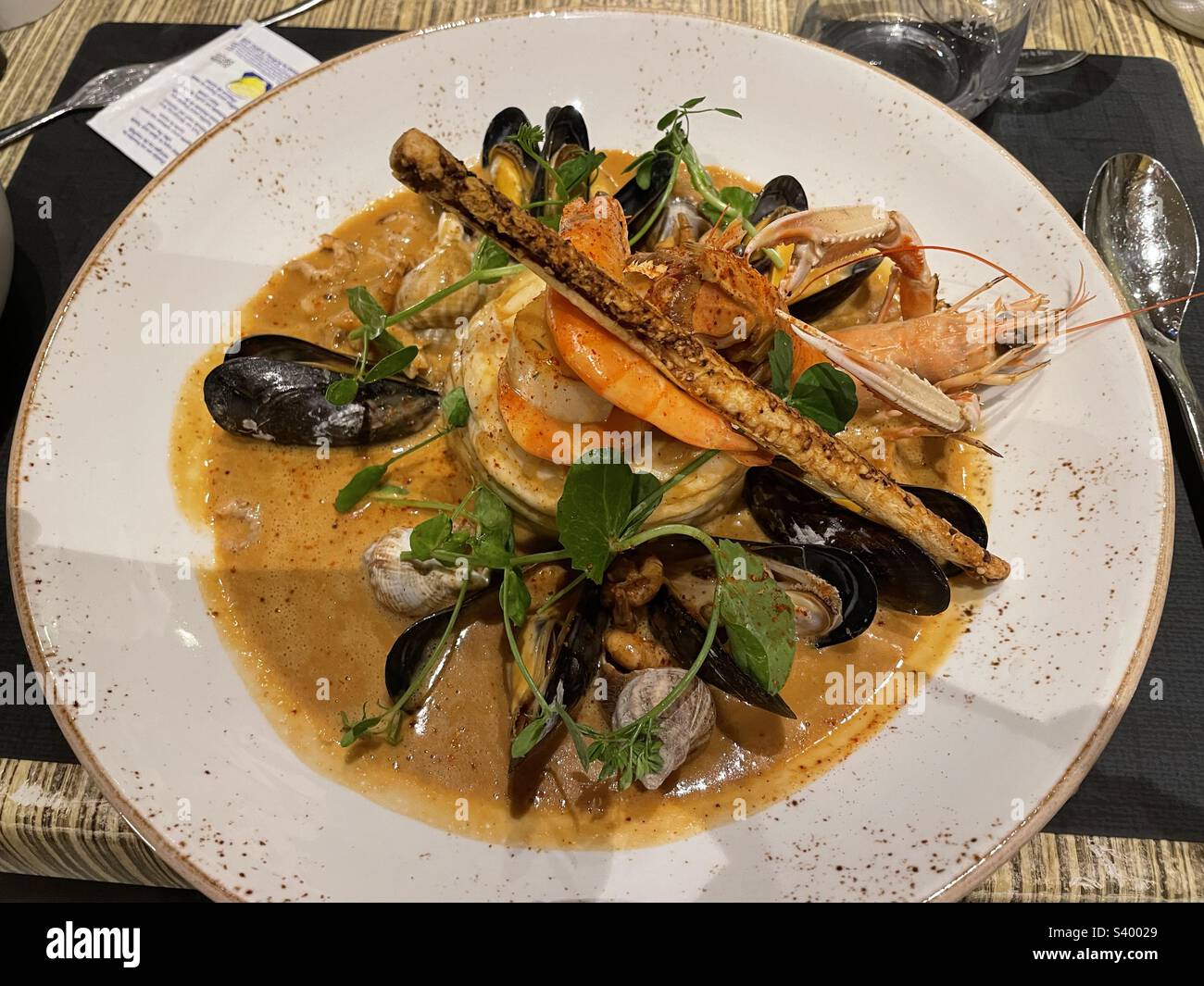 Fillets of Dover sole in a lobster bisque sauce served at Den Gouden Carpel (the Golden Carp) restaurant in Bruges, Belgium. - Smartphone Captured Stock Image