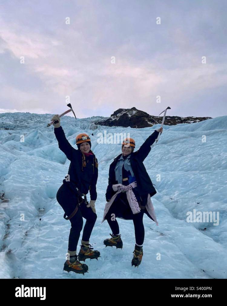 Two young women hiking a glacier in Iceland - Smartphone Captured Stock Image