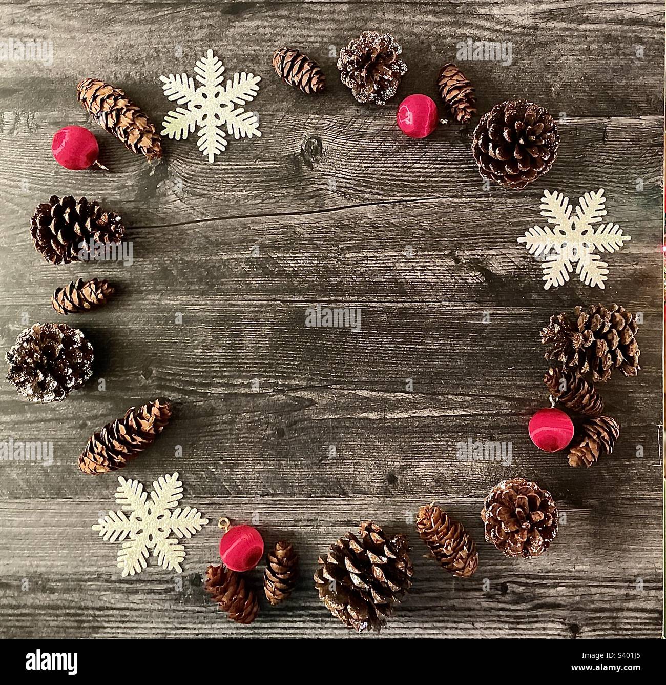 Holiday flat lay pinecones in ornaments, space for copy - Smartphone Captured Stock Image
