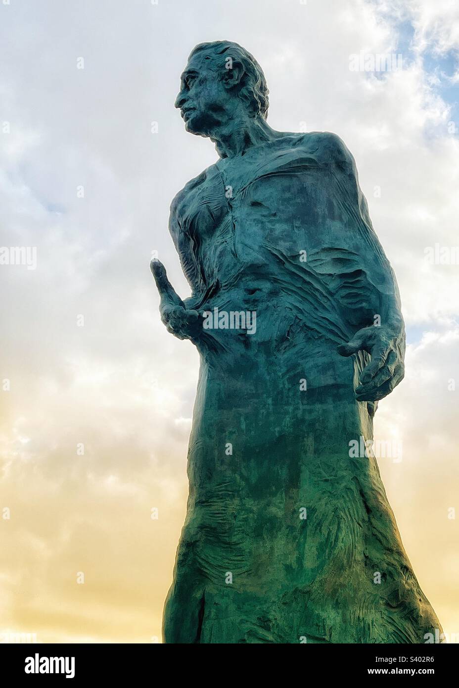 Giant statue of Alfredo Kraus Trujillo the famous opera singer from Las Palmas outside the auditorium named after him in the Canary Islands as the sun rises - Smartphone Captured Stock Image