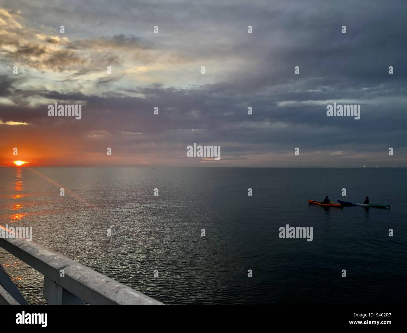 A sunrise brings everyone to a standstill even on the water Stock Photo