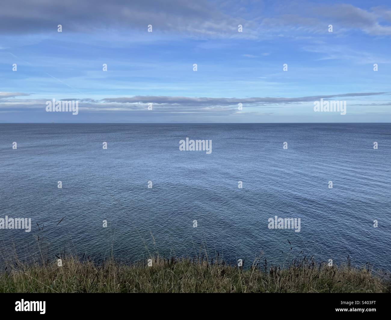 Walking in Lossiemouth viewing the North Sea Stock Photo Alamy