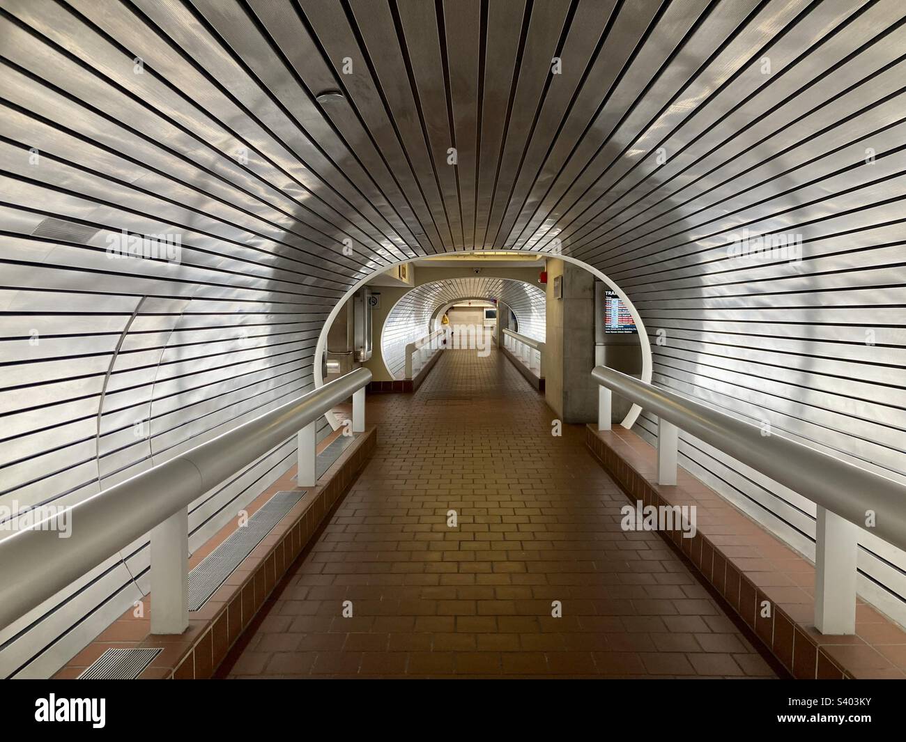 New Haven, Connecticut, USA – November 26, 2022: modern tunnel to trains at Union Station in New Haven.  It is the main railroad passenger station in New Haven. - Smartphone Captured Stock Image