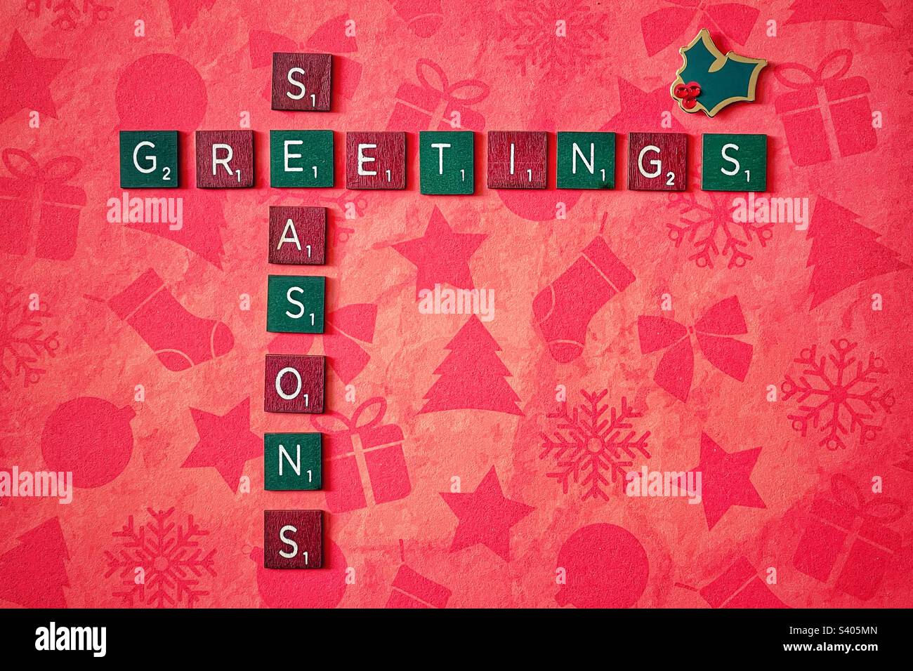 Green and Red wooden tiles spelling out Seasons Greetings. - Smartphone Captured Stock Image