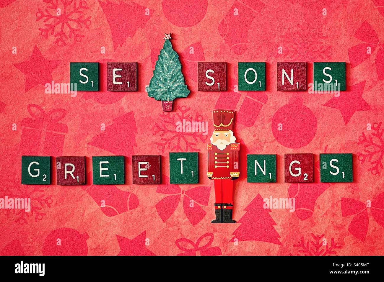 Green and Red wooden tiles spelling out Seasons Greetings. - Smartphone Captured Stock Image