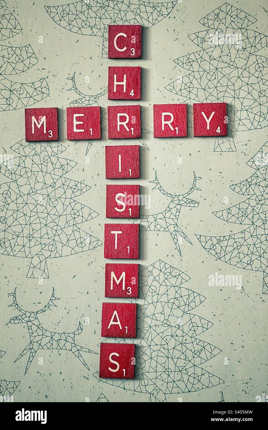 Red wooden tiles spelling out Merry Christmas. - Smartphone Captured Stock Image