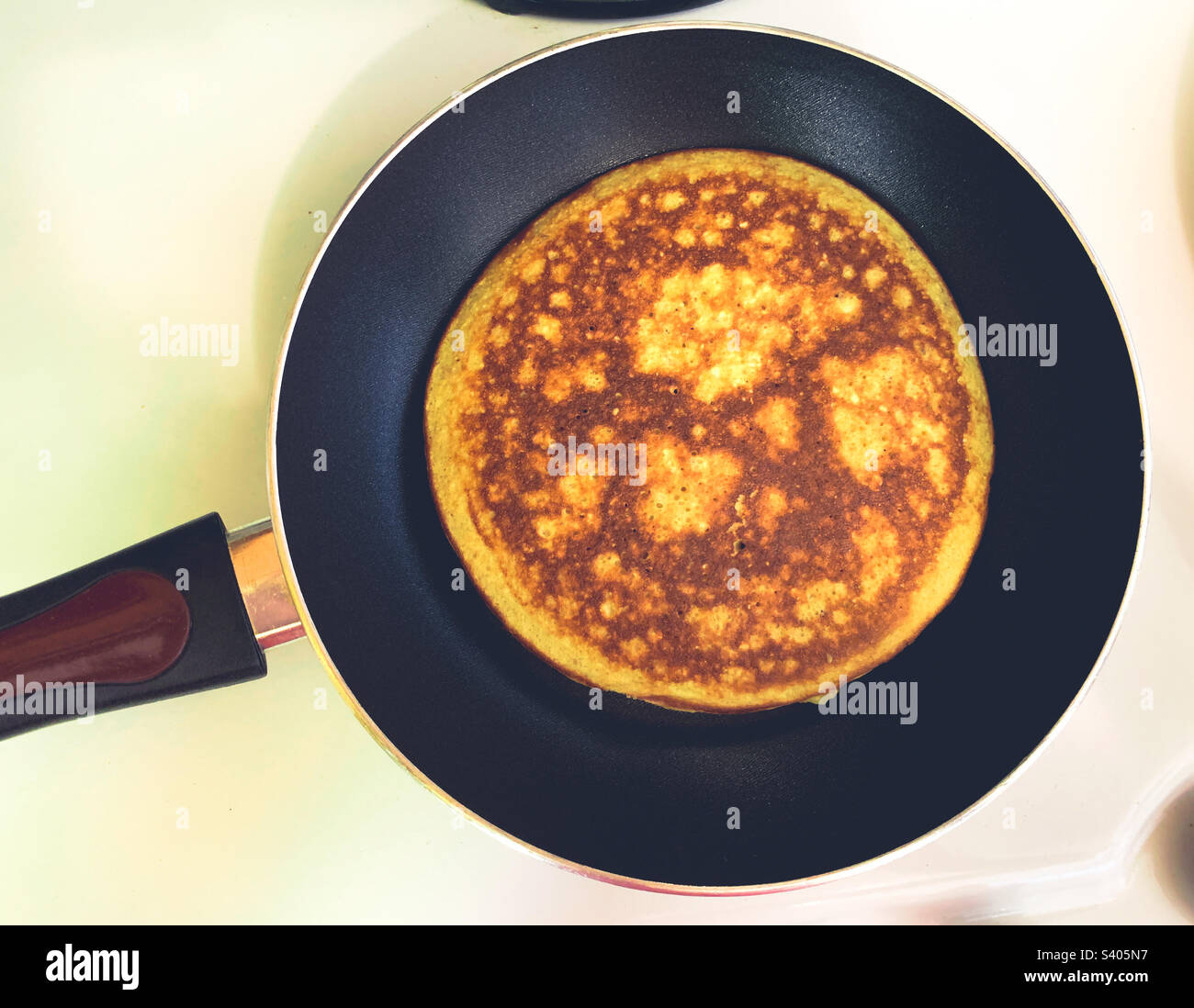 Banana matzo meal pancake on skillet - Smartphone Captured Stock Image