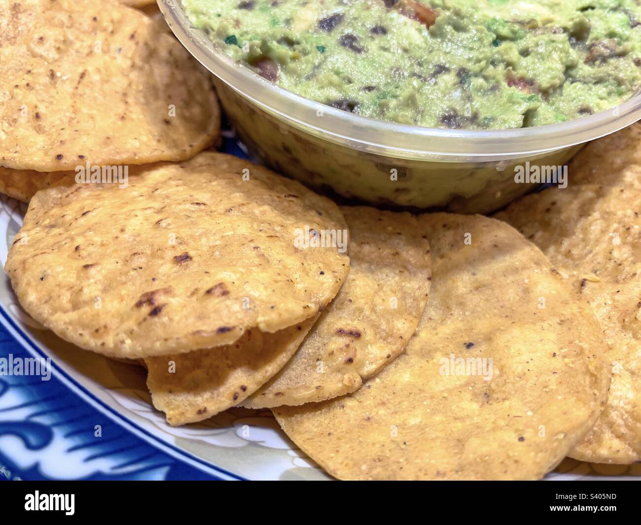 Guacamole and chips in a bowl - Smartphone Captured Stock Image Guacamole and chips in a bowl - Smartphone Captured Stock Image