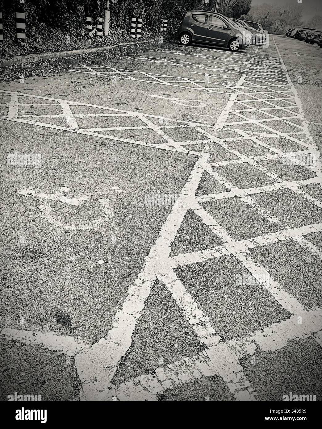 Disabled spaces in a car park. Black and white photo Stock Photo